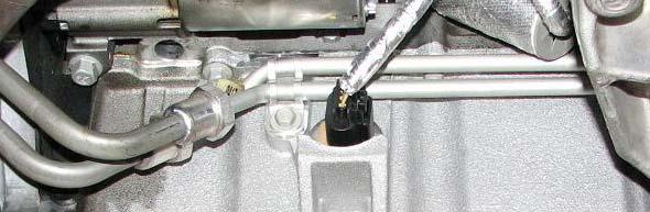 Loosen the rear engine cradle nuts with a 21mm deep socket and lower them until there is a gap of 10mm from