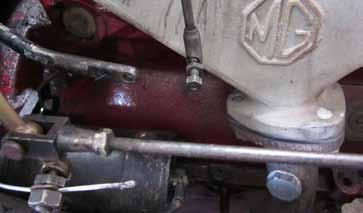 7. Remove the throttle linkage from the throttle