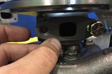 Using a stud tool, install the two supplied studs into the wastegate side of the cast elbow.