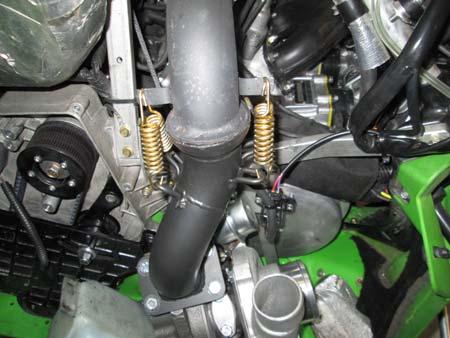Hold turbo in place, rout short water line to inside fitting on turbo, route