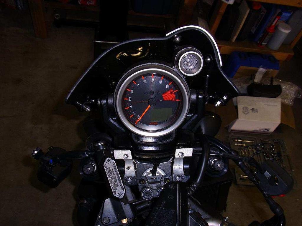 4) Unfasten the two throttle cables from the Throttle Grip and slide the Throttle Grip off of the handlebars.