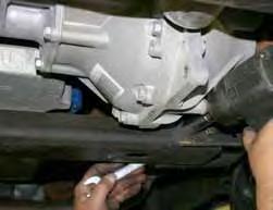 Disconnect the OEM front drive shaft from the front differential & support the front differential using a transmission jack.