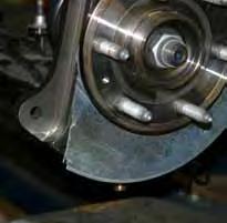 or similar tool. (See Photo # 28 & # 29) Reinstall the OEM brake rotors & OEM brake calipers using the OEM hardware. 31.