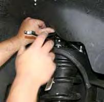 Remove the OEM strut assemblies by removing the lower mounting bolts &
