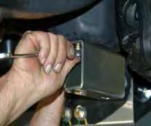 (See Photo # 31) Photo # 31 52. Install the OEM disc brake shields using the OEM hardware & a 8mm socket / wrench.