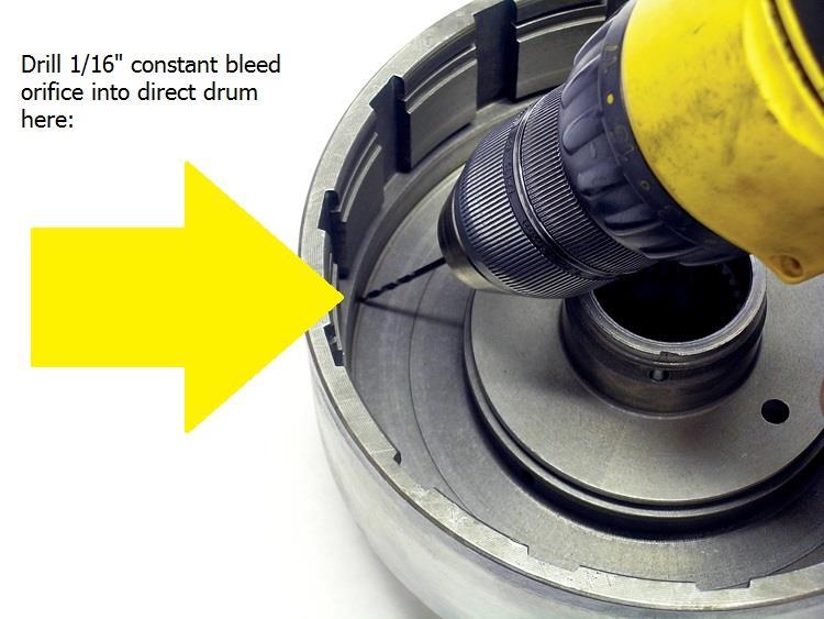 (Figure 2) 7. Once the bleed hole has been installed, remove the center lip seal from inside the drum and discard it. Re-install the direct apply piston.