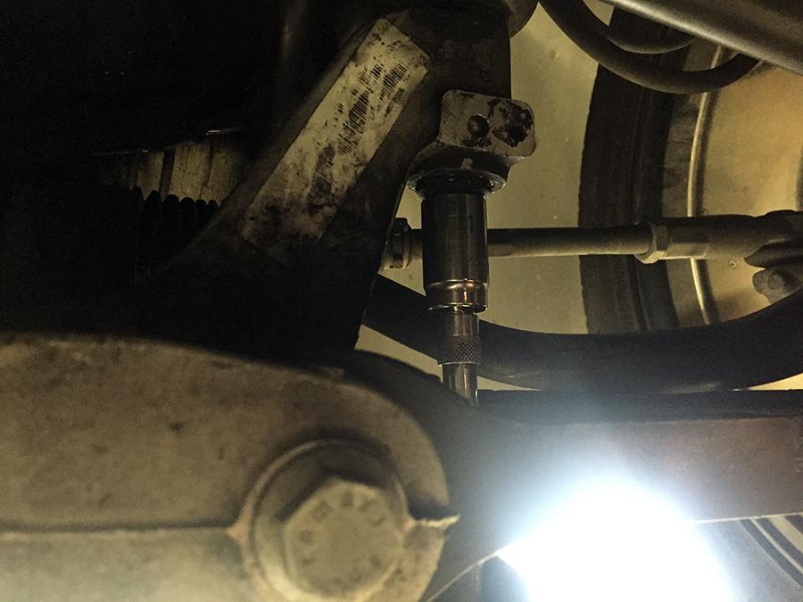 Step 11 Next, remove the subframe to frame rail bolt, pictured below, on both sides using an 18mm socket.