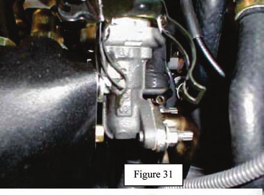 Note: The intake chamber is photographed off the engine for clarity. If the fittings match, then proceed with Step 68.