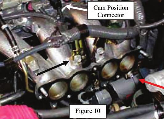 24. Remove the 2 bolts from the fuel return pipe and disconnect the fuel return hose from fuel pressure regulator. See Figure 9. Caution: Plug fuel return hose so that no fuel will spill.