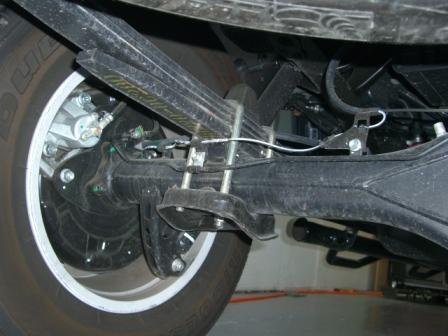 Carefully lower axle and