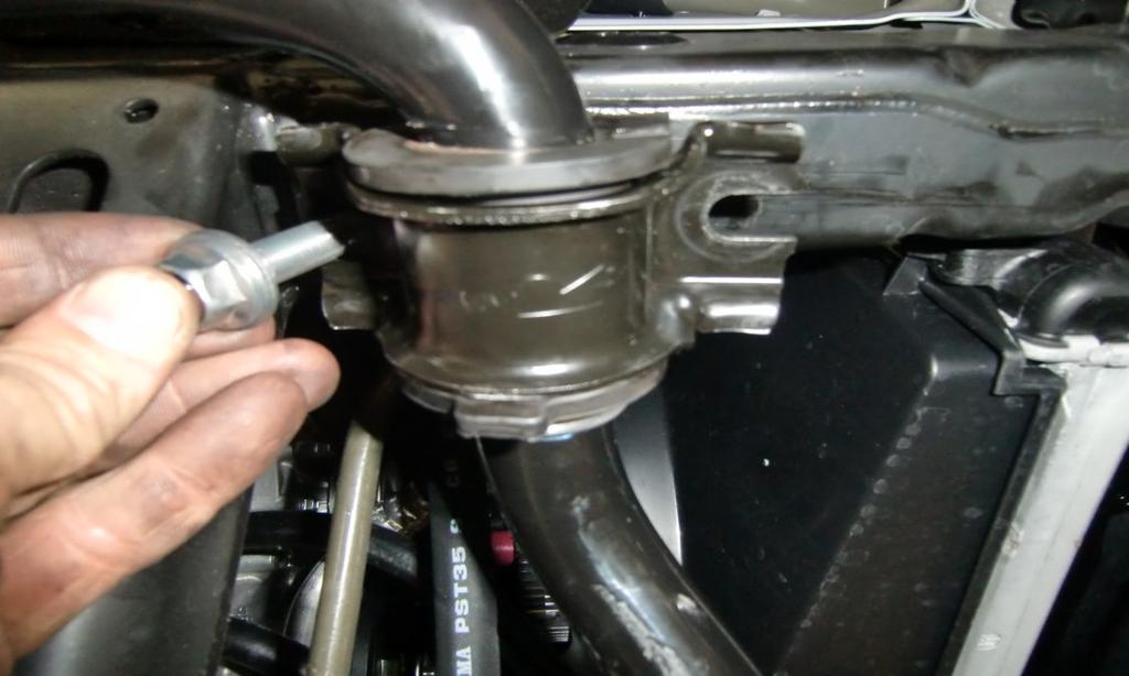 Install the lower ball joint cradle to the knuckle using the factory hardware, and a drop of thread locker.