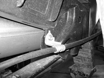 Disconnect the brake line bracket from the rear axle. Figure 30a 85.