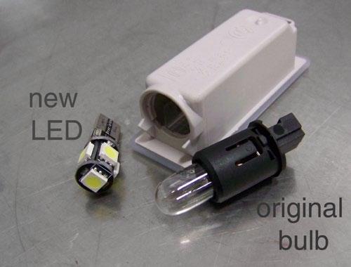 Replace the original bulb with a 5-chip wedge style LED.