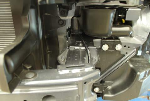 9. Using a 12MM socket, remove the four (4) bolts from the bumper core.
