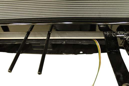 Using the provided cable tie, relocate the temperature sensor by attaching it to the baseplate.
