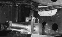 The vise portion of the clamp is secured to the rail by tightening the horizontal bolts of the attachment. (See Figure 18.