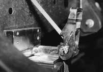 A tie down strap and ratchet assembly can be used with the attachment when upward pulls are required.