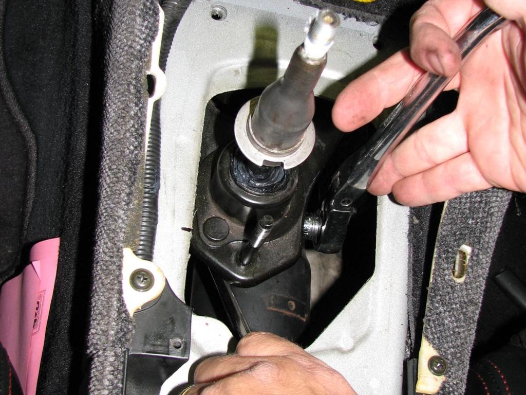 Remove your shifter (stock shifter shown) Hold nut with long 12mm wrench while loosening bolt with short 12mm socket and ratchet.