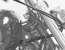 frame backbone, over ignition switch housing, through throttle cable guide between coil bracket and frame, and downward to carburetor.. See Figure -.
