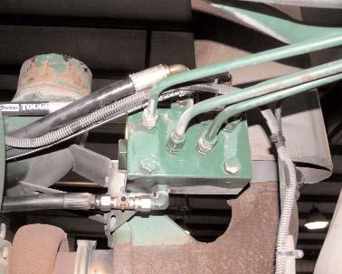 ) Return Line On some tractor models, the pressure line is routed toward the front of the tractor instead of the back.
