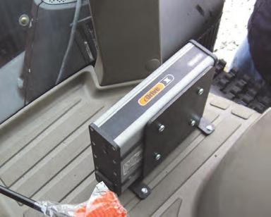 1. Install the ECU. a. Identify the ECU mounting location on the cab floor inside the right door.