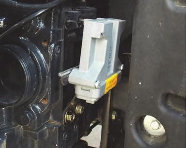 Using hardware EL mount steering controller EK on its bracket EI. Mount EK with its connectors downward and the pressure wash warning outward (Figure 1b). 2. Connect to the factory autosteer valve.