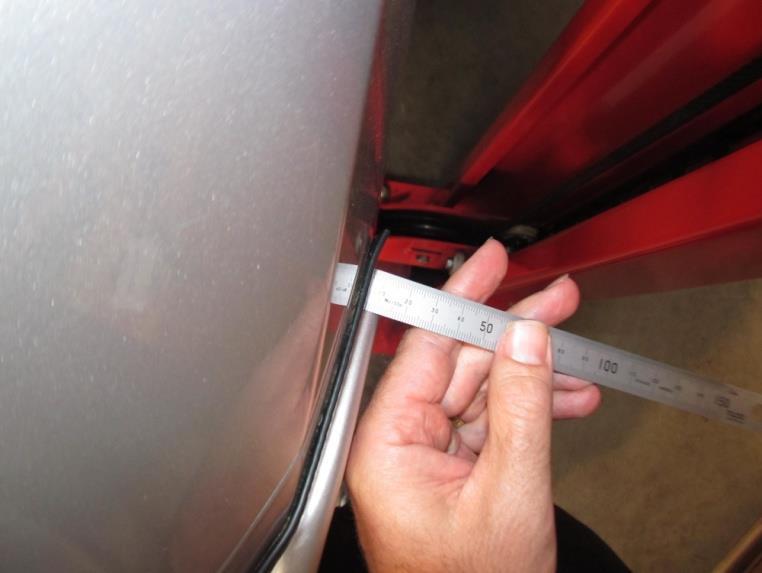 50. Measure the distance from the RH vehicle fender to the outer face of the RH bull-bar wing. Repeat on the LH side to confirm the bar is sitting centrally on the vehicle. 51.
