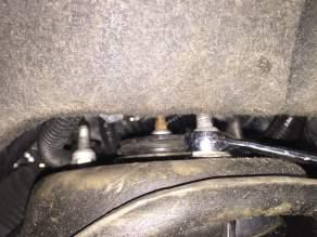 pressure on upper control arm by inserting pry bar