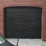 Vertica opening aso means fitting ThermaRo to an arched garage makes a very neat job and preserves the arched feature.