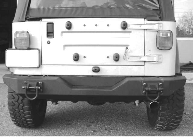 Note: If installing bumper onto a CJ, tighten the side-frame brackets M0x 00 bolts and nuts at this time. 8. Mark and drill holes in the side frame rail using a 9/6 drill bit (Figure ).