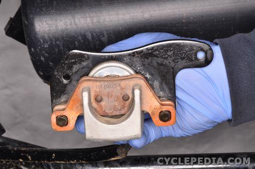 Apply silicone grease to the caliper