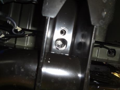 Figure 3 4. Loosen the bolts attaching the bed to the truck using an 18mm wrench. 5. Remove the OEM sensors from their housings (4 in total). 6.