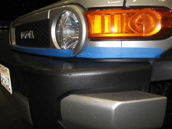 INSTALLATION: Step 1: Place masking tape on the areas of the front fenders, headlights and grill that can be