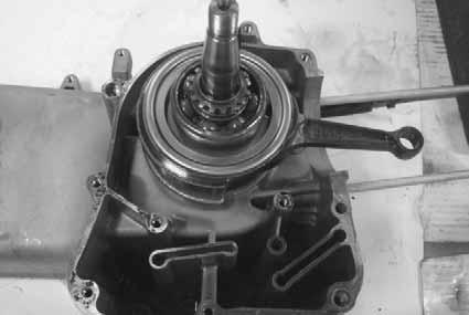 the left crankcase. Never use a driver to pry the crankcase mating surfaces apart.