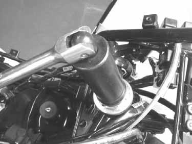 Tighten the top cone race and then turn the steering stem right and left several times to make steel balls contact each other closely.