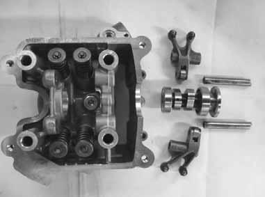6. CYLINDER HEAD/VALVES DOWNTOWN 125i DISASSEMBLY Take out the valve rocker arm shafts Remove the valve rocker arms.