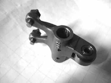 If the valve rocker arm contact surface is worn, check each cam lobe for wear or damage.