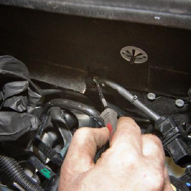 Z 28 Re-install the air intake tube to the inlet of the airbox/engine cover using a pair