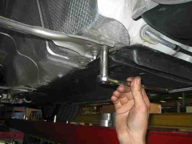 12. Install the downpipe oxygen sensor in the corresponding bung behind the catalytic converter and tighten using the 22mm oxygen sensor wrench. (See Fig.