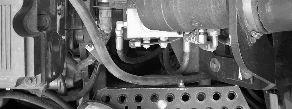 Before tightening these screws, slide the valve towards the cab by pushing against it so that it clears the electrical connectors located in