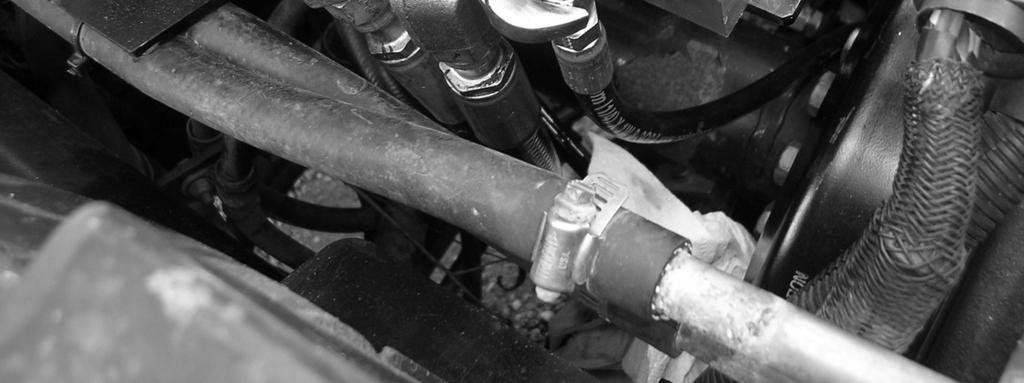 Tighten all hose adapters and hose fittings on this side of the valve. Connect the Left Steering Hoses Connect the Left Steering Hoses 1.