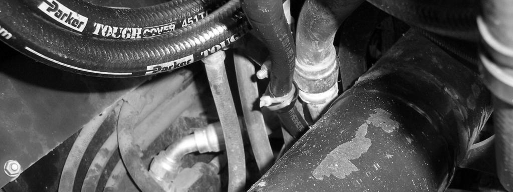 Connect the Right Steering Hoses Note: All hoses must be routed in a protected position and must not touch the engine drive shaft or flywheel that pass under the valve.