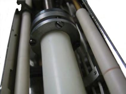 Place the Extender Tube back into the plasma source. Insert the PBN Shield into the Extender Tube (Figure 12). Place the Extender Tube back into the plasma source.