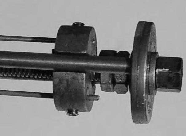 Rotate Drive Screw with Nut (a) clockwise to stop.