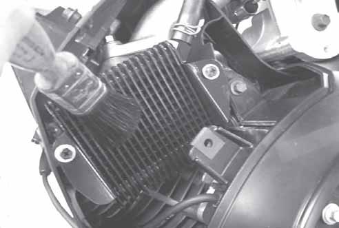 To access and service the oil cooler, remove the top mounting screw and loosen the two side screws, then lift off the No. 2 side cylinder shroud.
