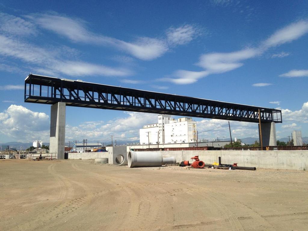 Construction Progress 38 th /Blake Station pedestrian bridge in place on piers, will allow safe