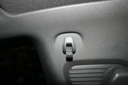 1. With the key in the on position, lower the front windows to the down position.