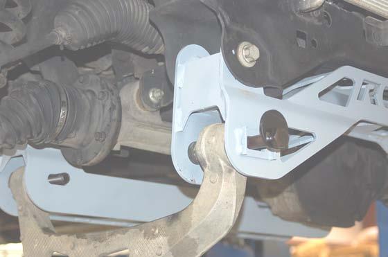 bolts using a 5mm wrench and tighten the lower differential bolts using a 8mm and 9mm wrench. See Photo 8.