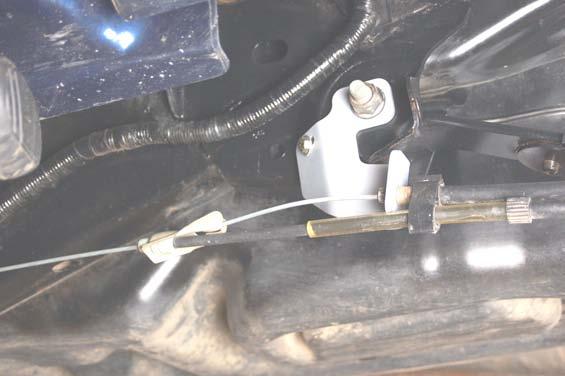 It may be necessary to slightly bend the clip on the e-brake cable to ensure the cable remains on the