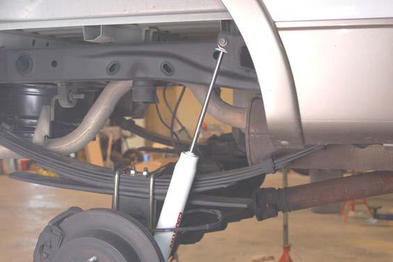. Install the bushing and sleeves into the shocks and install on the truck with factory hardware.